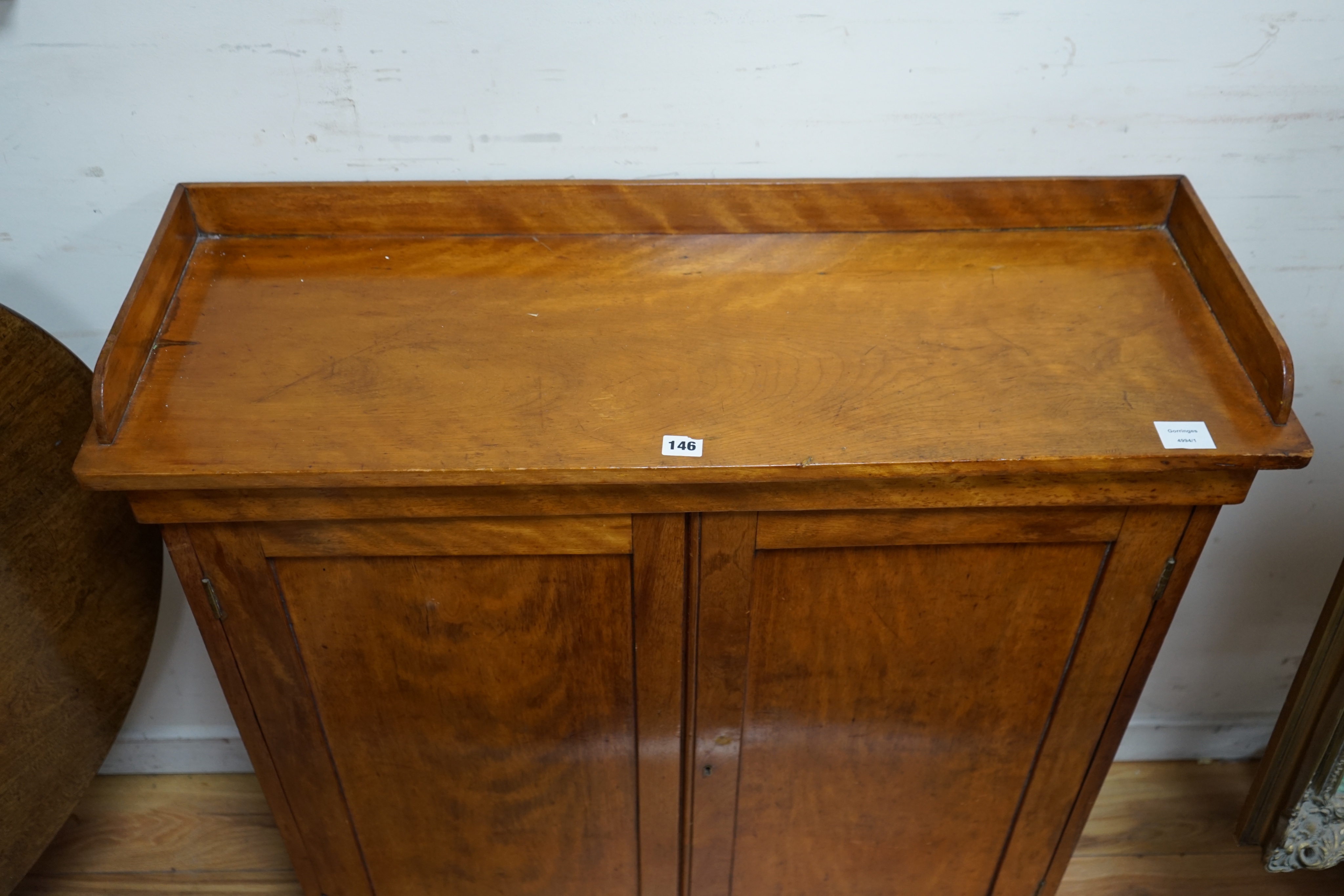 A Victorian mahogany side cabinet, fitted with twin panelled doors, width 96cm depth 33cm height 98cm